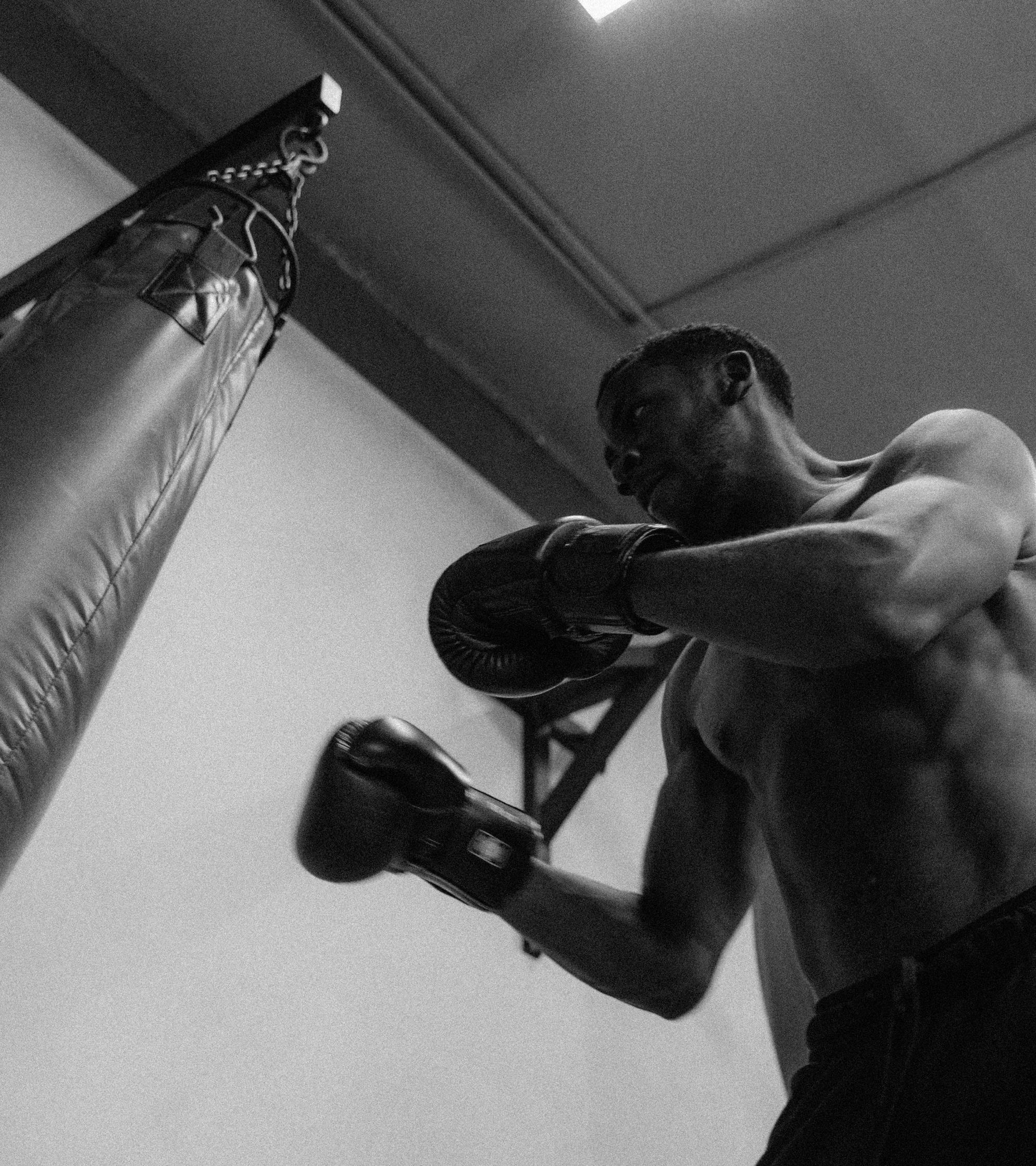 Fighter training on heavy bag